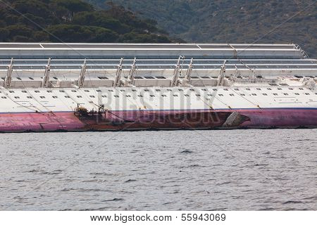 Giglio, Italy - April 28, 2012: Costa Concordia Cruise Ship At Italian Giglio Island Coastline After