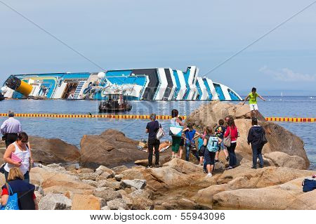Giglio, Italy - April 28, 2012: Costa Concordia Cruise Ship At Italian Giglio Island Coastline After