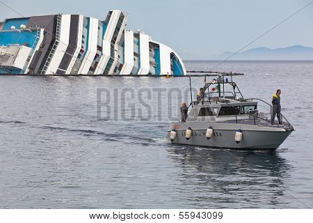 Giglio, Italy - April 28, 2012: Costa Concordia Cruise Ship At Italian Giglio Island Coastline After