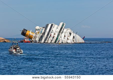 Giglio, Italy - April 28, 2012: Costa Concordia Cruise Ship At Italian Giglio Island Coastline After