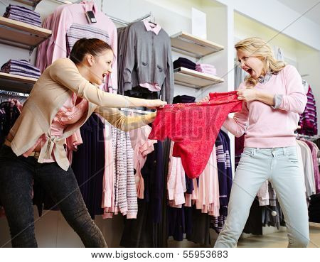 Image of two aggressive girls fighting for the last red tanktop in department store