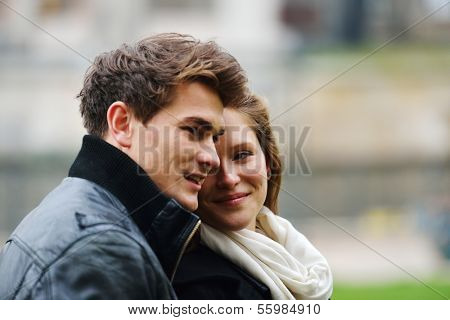 Lovely couple enjoying fall in love at park
