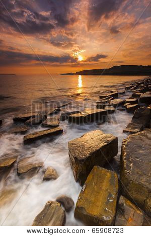 Waves wash over the rocks at Kimmeridge in Dorset