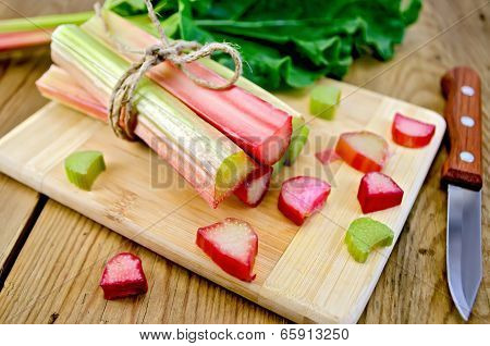Rhubarb Cut On Board With Knife