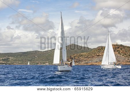 AEGEAN SEA, GREECE - APR 27, 2014: Unidentified sailboats participate in sailing regatta 