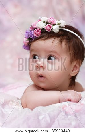 Cute little girl in a floral chaplet