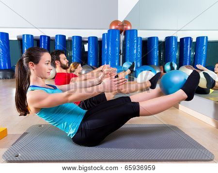Pilates softball the teaser group exercise at fitness gym