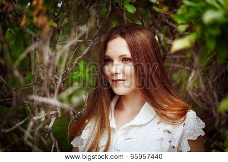 Beautiful Smiling Young Woman In Park
