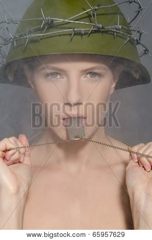 Woman In Green Helmet With Token In Smoke