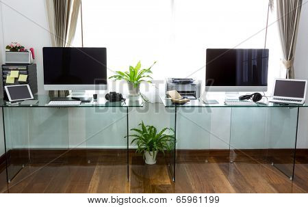 Modern home office with computer and labtop