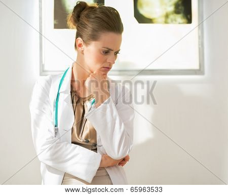 Portrait Of Thoughtful Medical Doctor Woman In Front Of Fluorogr