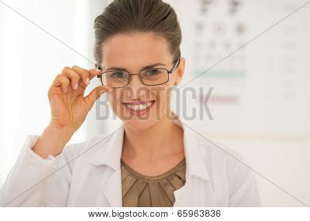 Portrait Of Smiling Ophthalmologist Doctor Woman Wearing Eyeglas