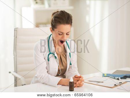 Medical Doctor Woman Yawning In Office