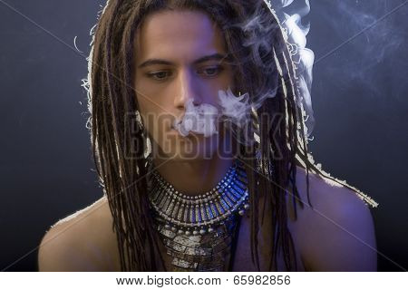 A Handsome Guy With A Cigarette And A Variety Of Stylish Silver Jewelry
