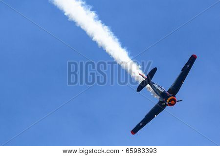BERLIN, GERMANY - MAY 20, 2014: The aircraft Red Bull Noorduyn AT-16 D-FHGK demonstration during the International Aerospace Exhibition ILA Berlin Air Show-2014.