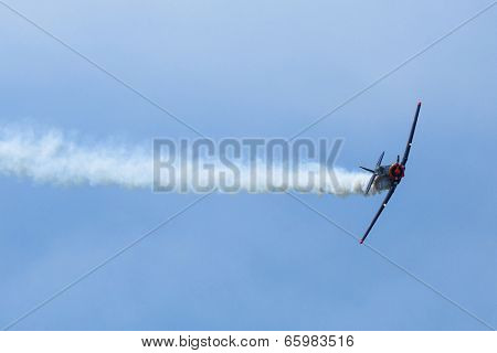 BERLIN, GERMANY - MAY 20, 2014: The aircraft Red Bull Noorduyn AT-16 D-FHGK demonstration during the International Aerospace Exhibition ILA Berlin Air Show-2014.
