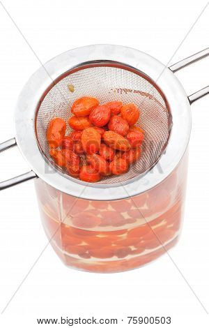 Strainer And Glass With Goji Berries Tincture