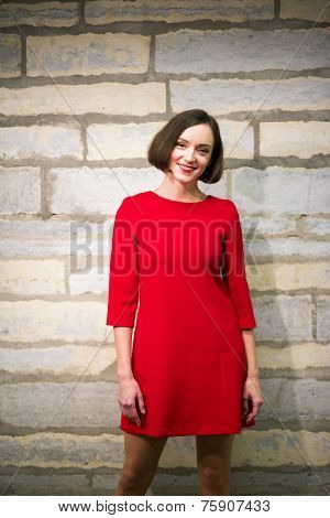 Woman In Hallway Stand On Limestone Wall