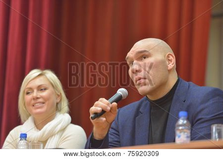 NOVOSIBIRSK, RUSSIA - NOVEMBERr 8, 2014: World champions in boxing Nikolay Valuyev and Natalia Ragozina talk with children. The meeting dedicated to the Friendship Cup and aimed to promote the sport
