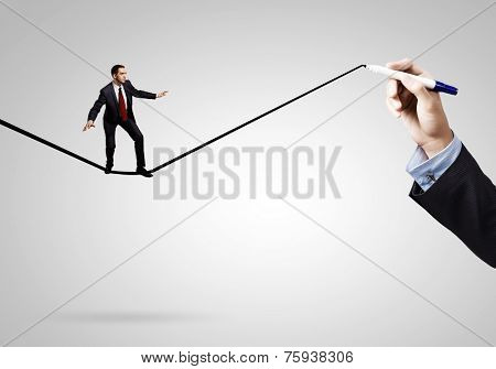 Businessman walking on drawn line. Risk concept