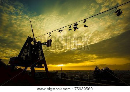 Prague Metronome, Shoes On A Wire At Romantic Sunrise