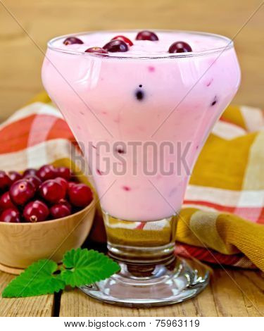 Yogurt thick with cranberries and napkin on board