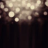 Abstract Festive Background. Glitter Vintage Lights Background With Gold And Black Lights, Defocused