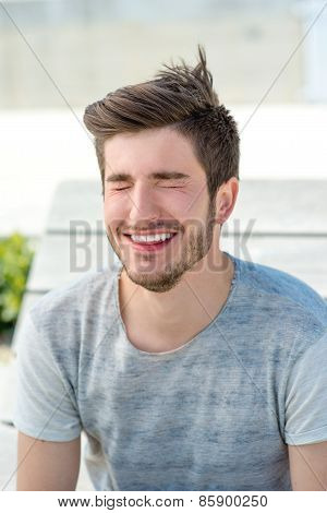 Portrait of a young man laghing