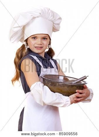 Little girl cook whips whisk eggs in a large plate, isolated on white background