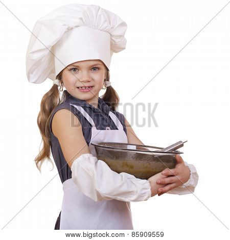 Little girl cook whips whisk eggs in a large plate, isolated on white background