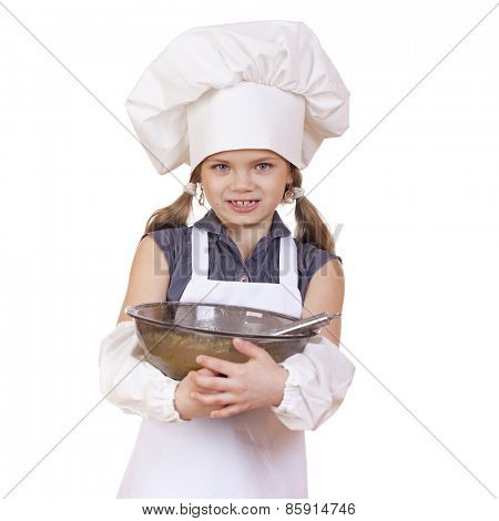 Little girl cook whips whisk eggs in a large plate, isolated on white background