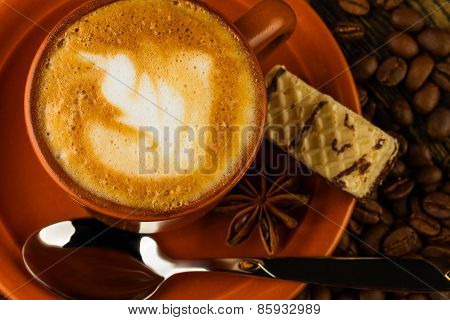 Cup Of Cappuccino, Milk-chocolate Wafer And Coffee Beans