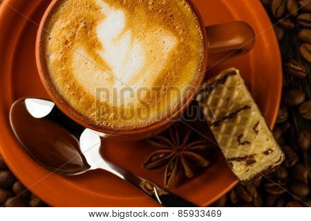 Cup Of Cappuccino, Milk-chocolate Wafer And Coffee Beans