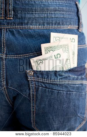 Five Dollars Banknotes In A Pocket Of Jeans