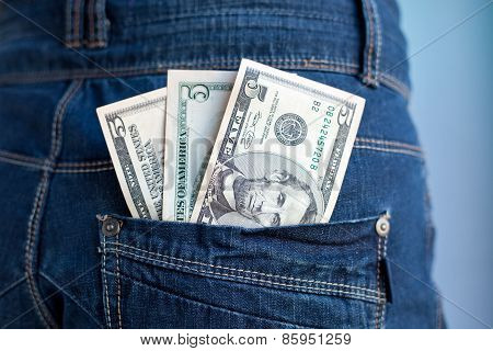 Five Dollars Banknotes In A Pocket Of Jeans