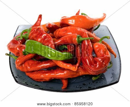Red And Green Peppers On Glass Plate