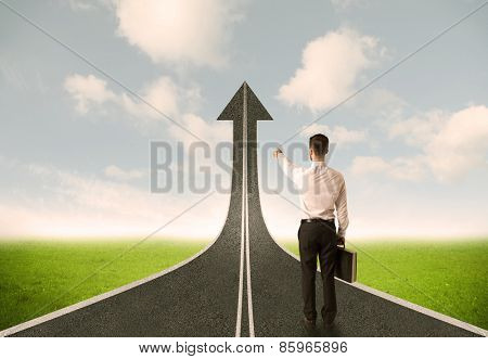 Businessman lokking at 3d road upgoing arrow concept