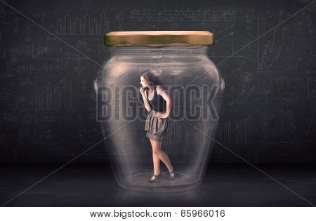 Businesswoman shut inside a glass jar concept concept on background