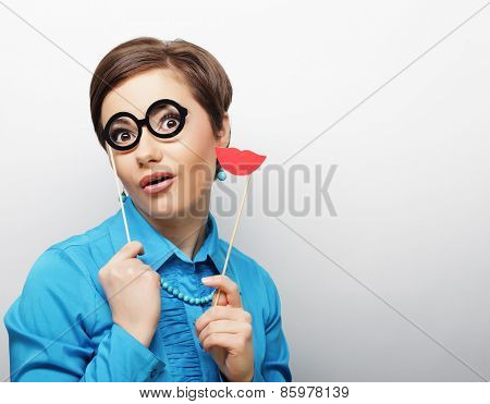 Attractive playful young woman ready for party - falce lips and glasses  