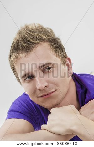 Portrait Of Smiling Caucasian Handsome Man With Curious Facial Expression.