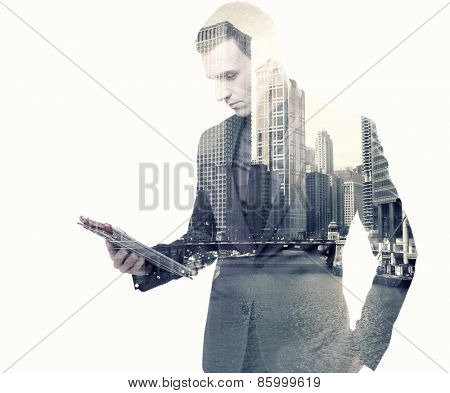 Double exposure of a businessman and a city using a tablet over white background