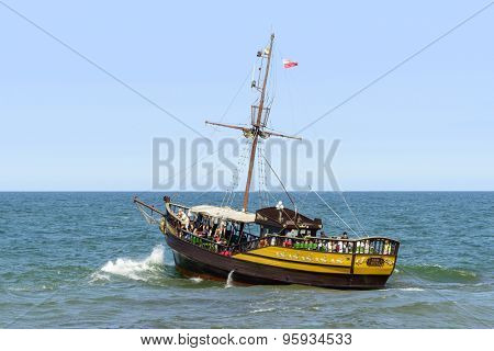 USTKA - JULY 07: Tourists enjoying the sunny weather and a cruise ship 