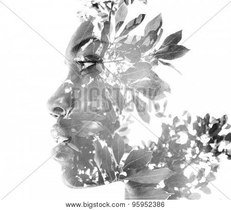 Double exposure portrait of attractive woman combined with photograph of nature