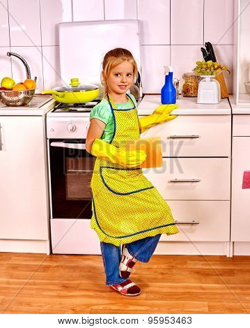 Children cleaning  kitchen. Happy small housekeeping with napkin .