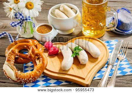 Traditional Bavarian meal. White sausage with sweet mustard and pretzel