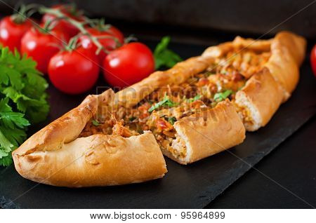 Turkish pide traditional food with beef and vegetables
