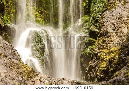 beautiful water fall in forest, new zealand, waipu, piroa falls
