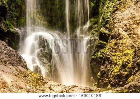 beautiful water fall in forest, new zealand, waipu, piroa falls