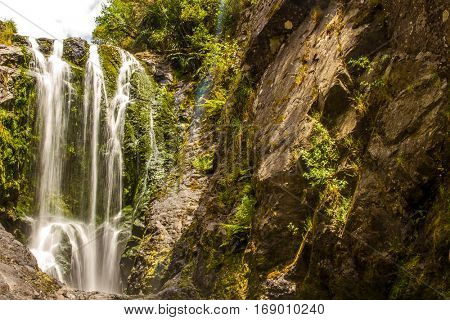 beautiful water fall in forest, new zealand, waipu, piroa falls