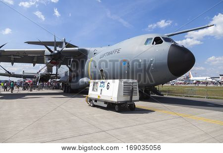 BERLIN / GERMANY - JUNE 3 2016: german Airbus A 400 M stands on airport schoenefeld / berlin. The Airbus A400M is a multi-national four-engine turboprop military transport aircraft.